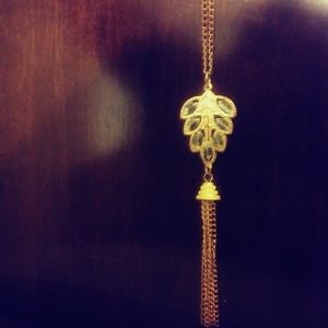 Long brass crystal leaf necklace